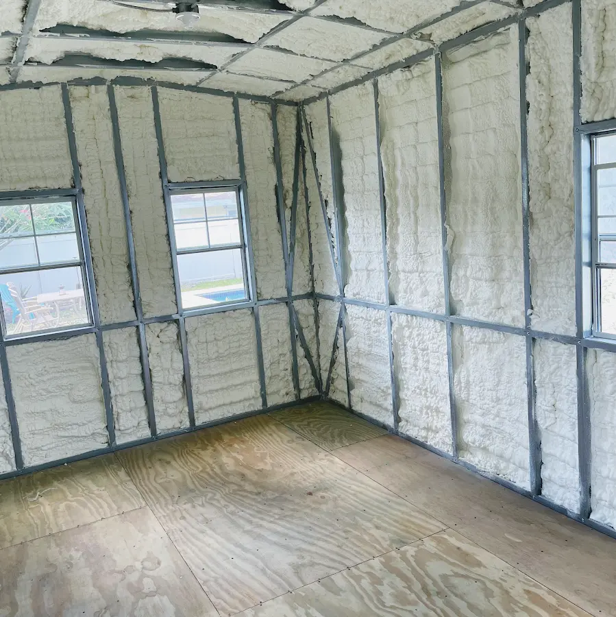 Closed-cell spray foam insulation applied to wall cavities in a residential project in Prairie Village